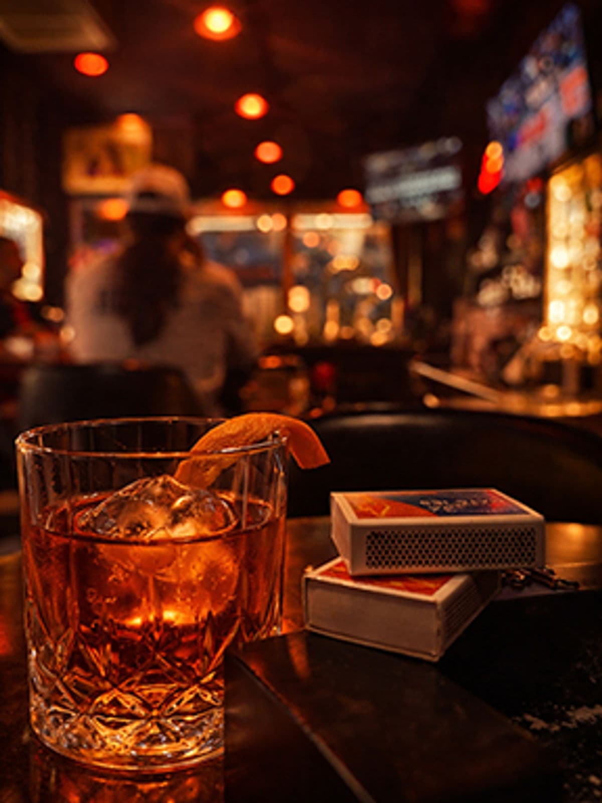 Cocktail and matchbooks on the bar inside the Cappelli Brothers lounge